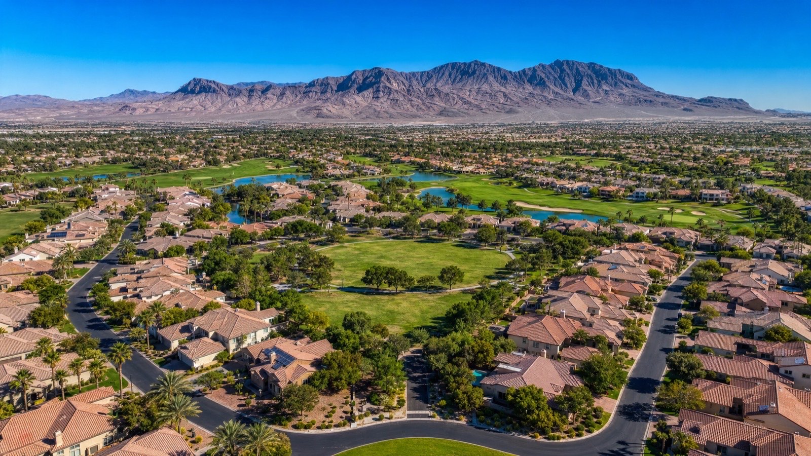 North Las Vegas residential neighborhood compared with the greater Las Vegas valley skyline in the distance